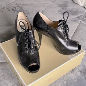 Michael Kors, black leather Tatum Oxford shoe.